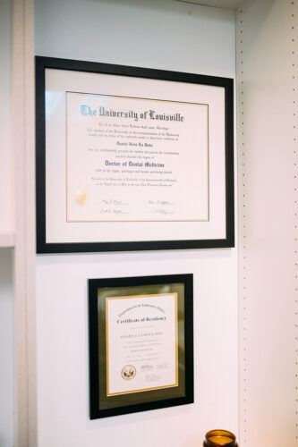 Certificates displayed on the wall inside Travelle Family Dentistry office in Burien, WA