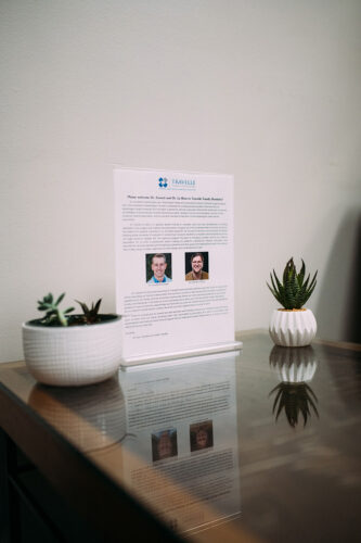 Chair and table set up in the waiting room of dental practice office in Burien, WA